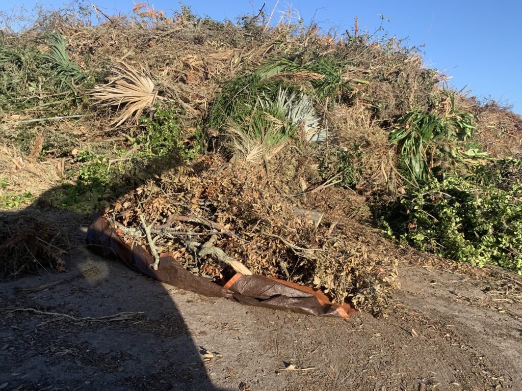 I slid that tarp right out of the van and rolled the yard waste into the pile. Easy peasy! 